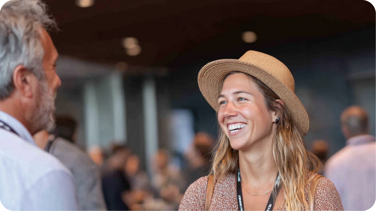 Event rental business owner shaking hands with venue coordinator at networking event 